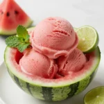 A refreshing scoop of watermelon sorbet served in a bowl.