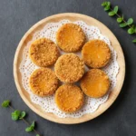 A slice of crispy pumpkin pie with a golden, flaky crust on a white plate