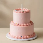 A pastel macaron cake decorated with stacked colorful macarons and delicate frosting.