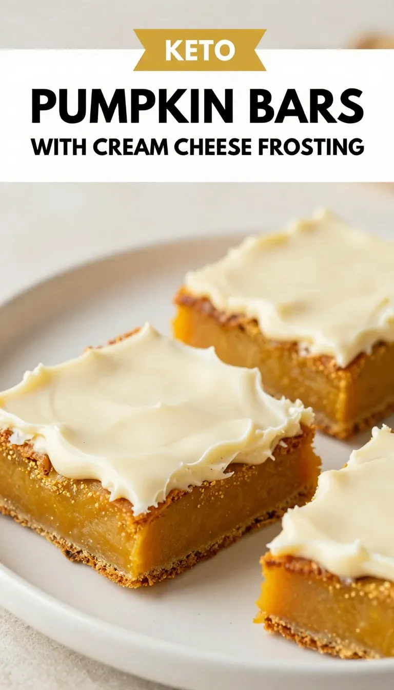A tray of keto pumpkin bars topped with creamy cream cheese frosting and a light dusting of cinnamon.
